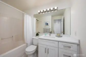Second bathroom with shower / tub combo. New vanity, counter top and paint