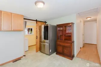From the kitchen hallway leads to the bathroom on the left and on down to the bedrooms.
