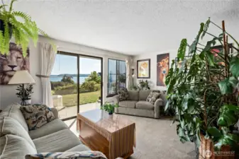 Typical living room in ground floor unit with on grade patio.