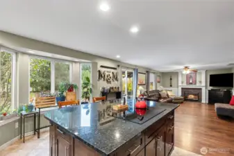 Kitchen space connects to the family room and tons of light into the fenced back yard