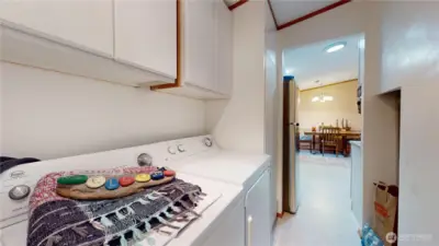 The laundry area next to the kitchen.
