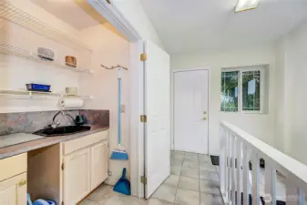 Sun Room Off The Kitchen Area w/Another Staircase To Downstairs.
