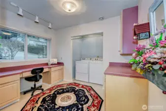 Large Main Level Utility Room. Storage Cabinets & Office Area.