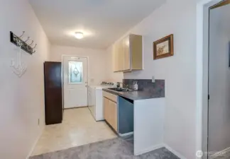 Downstairs Utility Room w/Washer/Dryer, Sink, And 2 Car Garage Access.