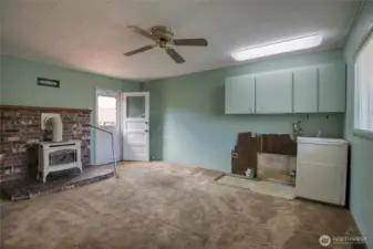Family room with gas stove and laundry