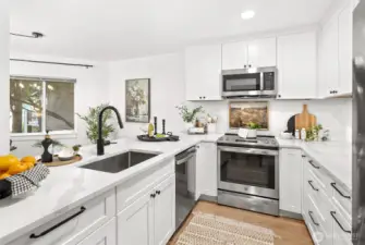 Remodeled kitchen with quartz countertops and soft close cabinets.