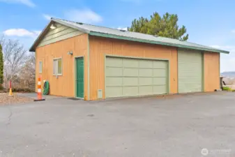 Garage/shop with one standard two car door and a 10' bay door.