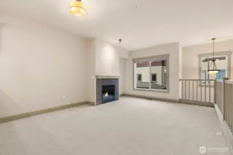 Dining and living room with gas fireplace.