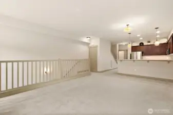 Another angle of the living room, dining room, coat closet and kitchen. Beyond the kitchen you will find the pantry, guest bath and guest bedroom/office which leads to the semi-private deck and patio.