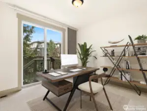 Main floor bedroom or office with access to back deck and patio