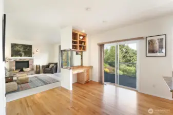The sitting room is open to the kitchen with access to the expansive deck.  Making this home perfect for entertaining.