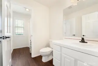 The second bedroom has its own private bathroom and shared shower room with the third bedroom.