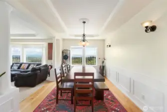 The luxurious dining room lets in the natural light and views.