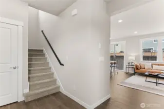 Inviting entry from garage with stairway access and seamless flow into the main living area.