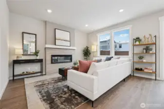 Great room just off the kitchen area!  Showing same home staged in the community.