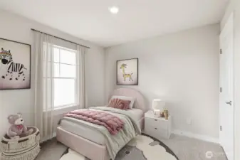 One of the three bedrooms upstairs, staged from a different home of the same plan.