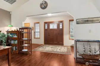 View from the family room toward the front entry. Hallway to the left leads to bedrooms & bathrooms.