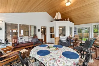 Full view of the Sun Room! This space, fully permitted, is where the deck was previously. Stylishly preserved the original home exterior to give a cabin-feel and offering magnificent windows allowing you to enjoy the beauty of your own yard.