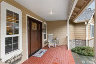 Welcoming covered front porch entry to home.