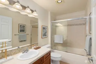 Spacious bathroom with soaking tub and plenty of storage and counterspace.