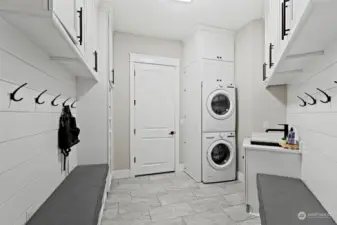 Main level extra laundry area off the garage with mud room. So much storage!