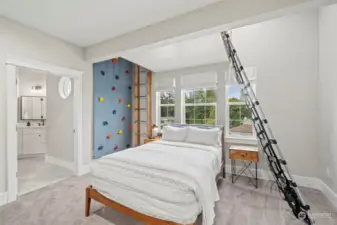 4th bedroom with a rock wall which can be removed, which leads up to a loft bed above the main bed. Fun kid room!!