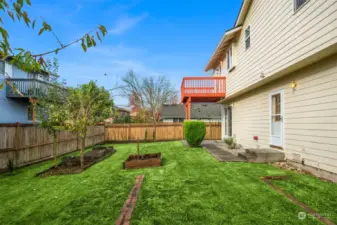 Level backyard with garden space.