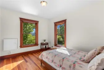 Cozy third bedroom with a front lawn view.