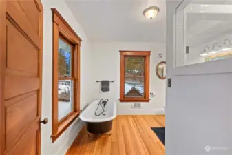 Second floor full bathroom with a peaceful, wooded view as you soak in the clawfoot tub.