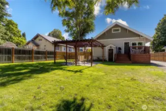 Backyard offers Deck off Kitchen and Pergola area for entertaining and relaxation.