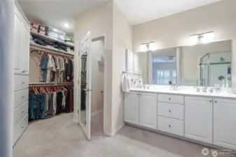 Large walk in closet with built-ins just off the primary bathroom