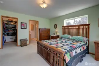 The opposite side of the primary has a spacious walk in closet and en-suite bath.