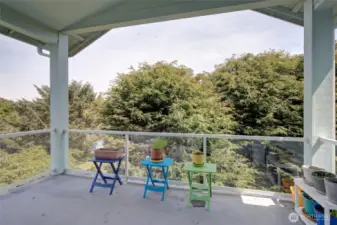 The back yard deck is covered, and very private and peaceful.