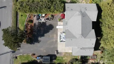 From above, you can see the thoughtful utilization of all the space on this lot.  From home placement, to landscaping, firepit area, greenhouse and garden space, parking....nothing was overlooked in the design of the entire home and property!