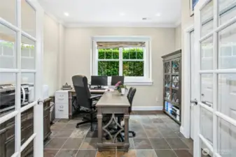 The lower level features a fourth bedroom which is currently being used as a second office. There is a full-sized closet along with recessed lighting, crown molding and French doors.