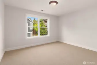 Ensuite bedroom on upper level.