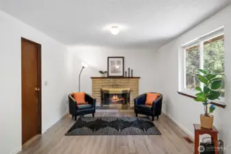 Additional family room with classic wood burning fireplace!