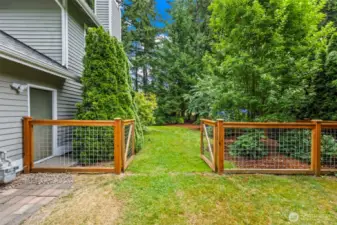 Beautiful fence borders the property. New in 2024.