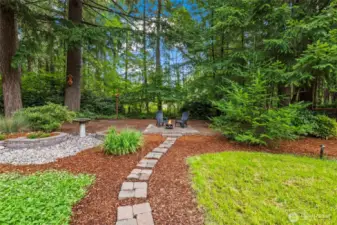 Thoughtfully curated landscape design. Low maintenance, enjoyable spaces. Fresh mulch July 2025.