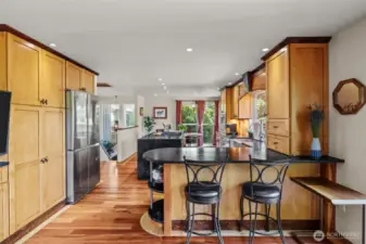 New Samsung refrigerator. Counter with eating space on both sides of the kitchen.