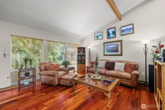 The Brazilian Koa floors are a beautiful and striking feature of the living room.