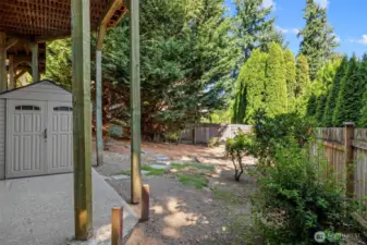 Shed and patio area under the upper deck.