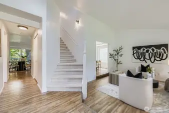 Vaulted ceiling living room with skylights.