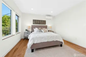 On the second floor, the primary suite beckons you for needed rest after a long day, keeping you cool or warm with zoned heating/cooling mini-split.
