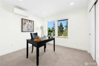 Also on the third floor, this bedroom is currently shown as an office. You will definitely keep cool/warm as you work/sleep with your own mini-split in this room as well!