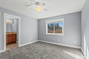 Primary Bedroom with Bathroom and Walk-In Closet