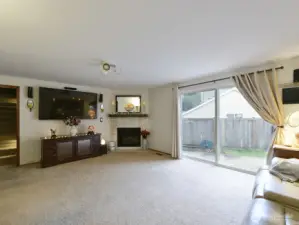 Living room with Slider door/ gas fireplace.