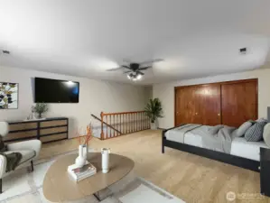 Staged upstairs bedroom Large and closet w/ shelves.