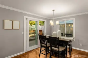 Patio leads to fully fenced yard