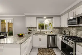 Quartz counters, SS appliances, incl gas range, shaker-style cabinets & stylish backsplash